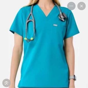 Women’s Caterina scrub top size XS. Jogger pants size S. Color teal